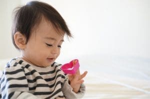 photo of child interested in toy