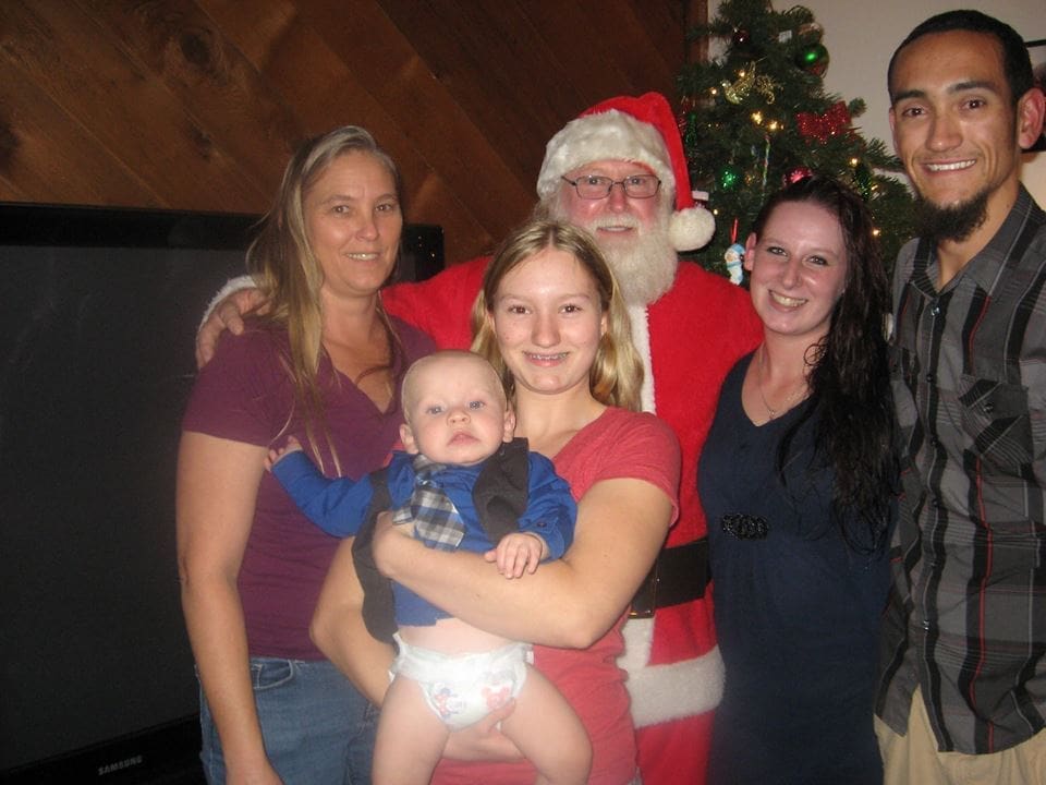 Amanda Moore Brings Santa with Gifts to Homes