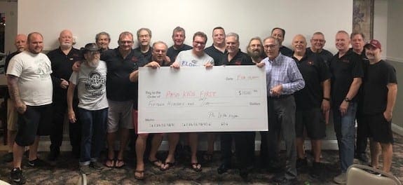 Fraternity Presents Check to Pasco Kids First